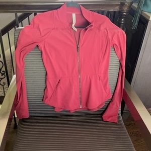 Lululemon workout jacket. Melon color, fitted style size 6.  Great condition!